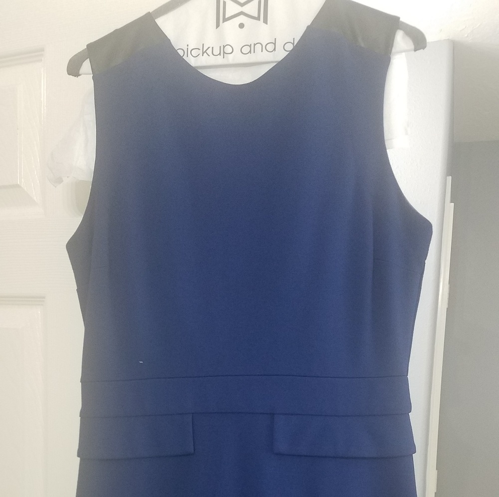 A beautiful blue dress with faux leather on the sh